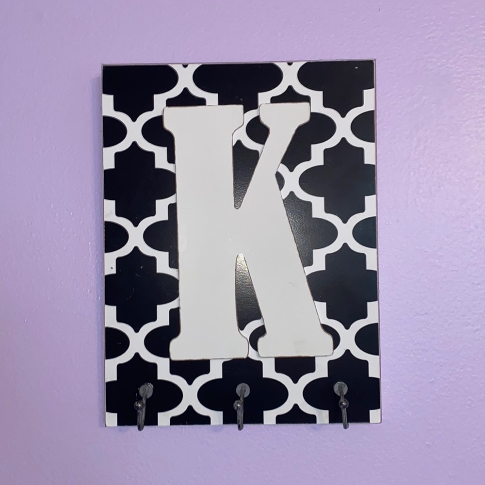 K wall sign with hooks